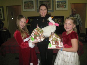 Sarah & Skye show off their gingerbread creations while their Aunt Patricia holds Em!
